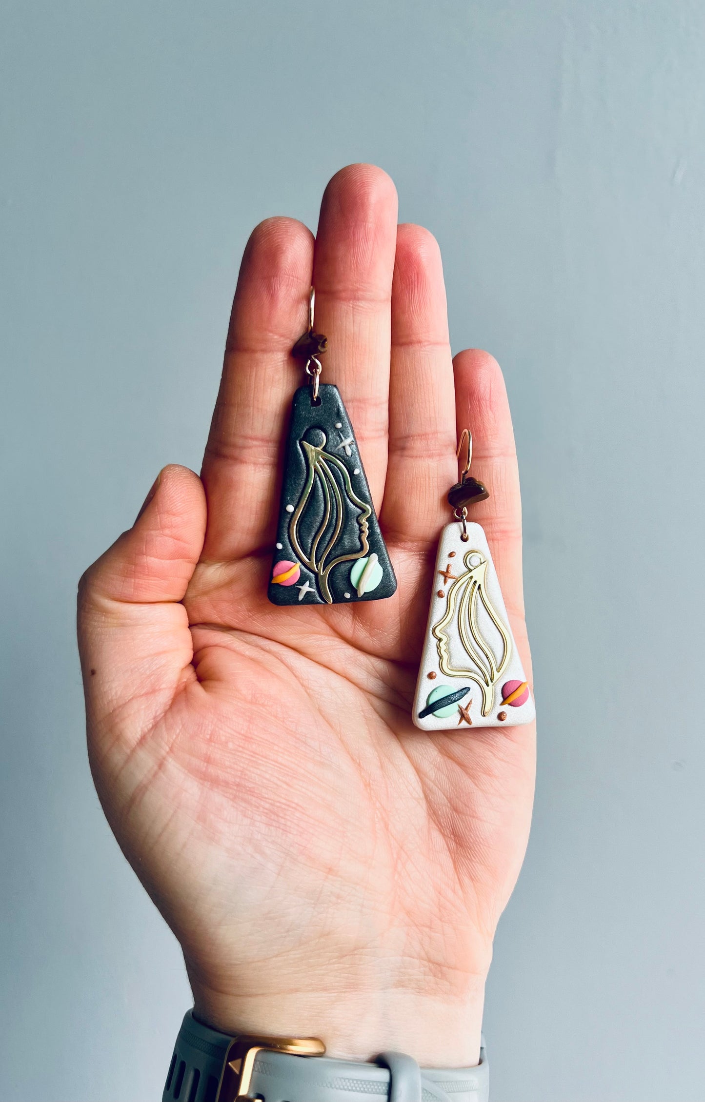 Gemini earrings embodying duality and versatility, crafted with artistic flair. These earrings symbolize the Gemini twins, reflecting adaptability and curiosity. Perfect for those born under the Gemini sign, embrace your multifaceted nature with these unique earrings. Shop now and celebrate your Gemini spirit!