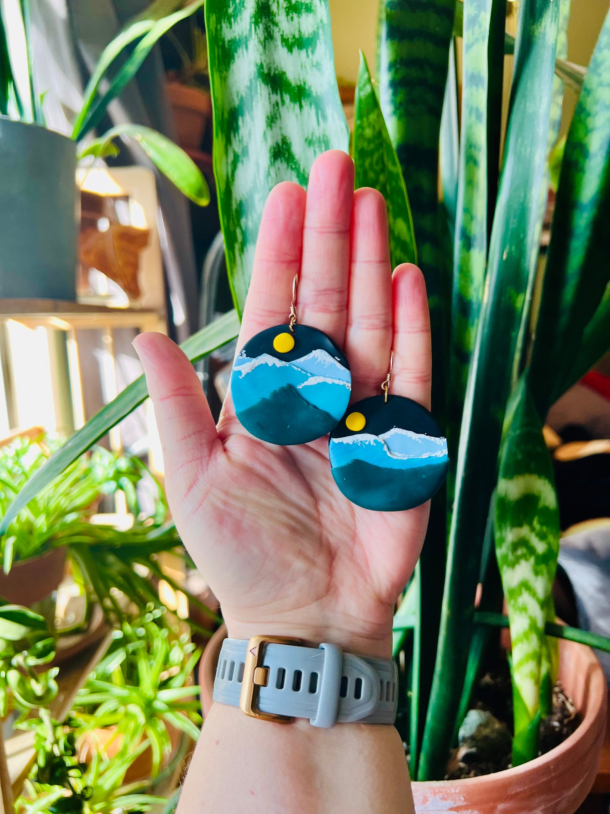 Capture the essence of mountain magic with our blue mountain earrings, reminiscent of the iconic Colorado Rockies. These earrings add a touch of serenity and outdoor charm to any outfit, perfect for those who love the great outdoors.