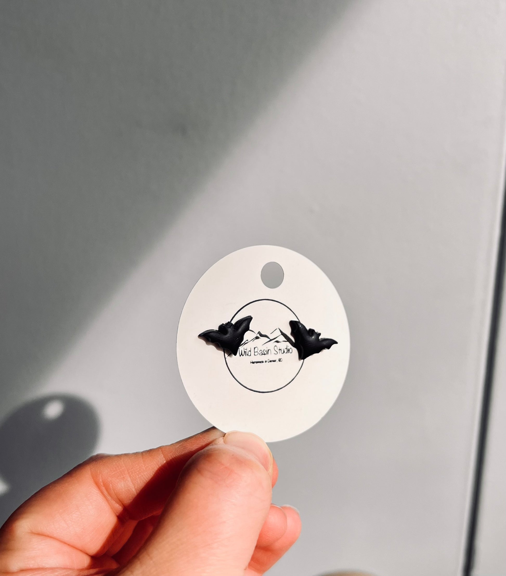 Delicate black bat polymer clay earrings. They are the perfect addition to any spooky SZN wardrobe.