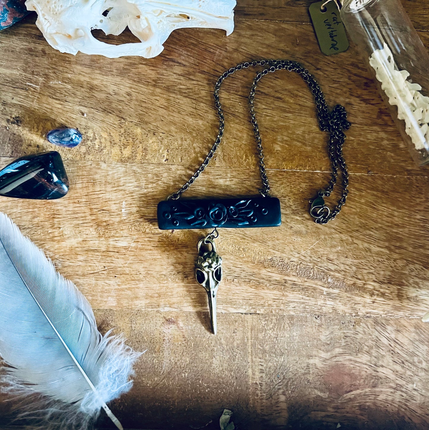 Explore the significance of the hummingbird, representing resilience and speed with this polymer clay hummingbird skull necklace.. Across cultures, they're seen as messengers bridging the divine and mortal worlds, inspiring hope and connection.