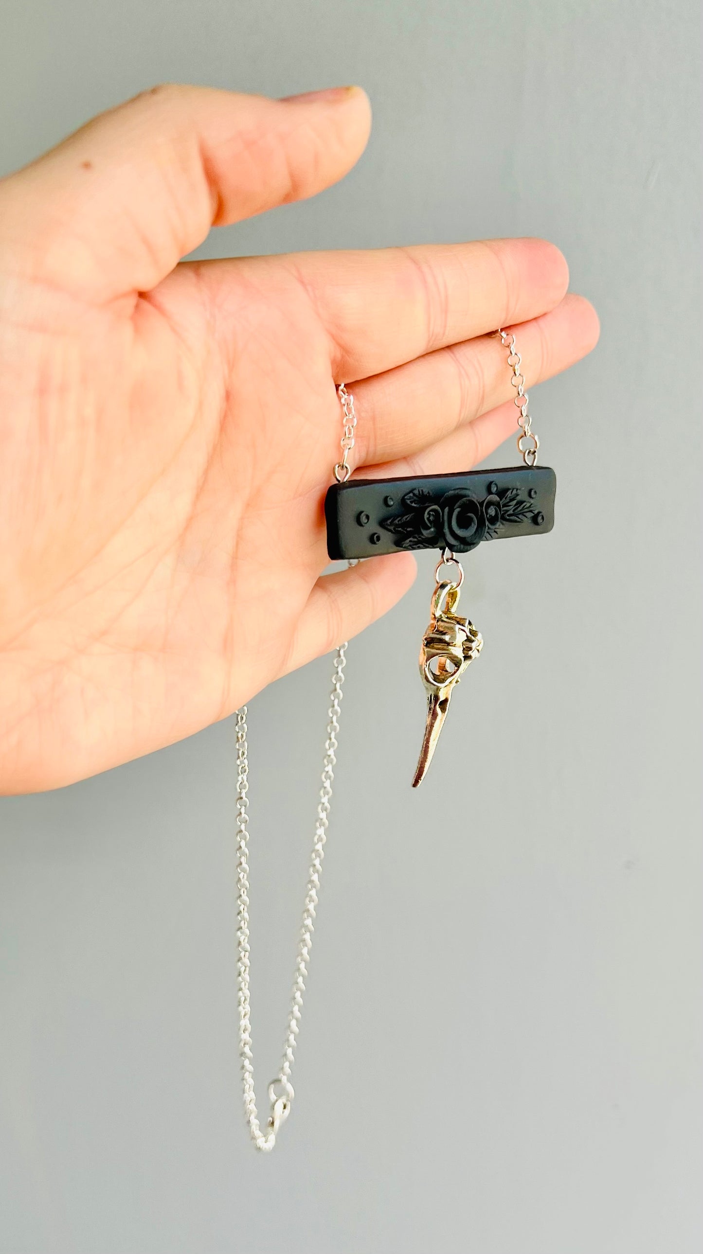 Delve into the symbolism of the hummingbird, epitomizing vitality and agility. Celebrated as messengers between realms in various traditions, these tiny birds offer a glimpse into the spiritual. Embody the hummingbird with this polymer clay and metal necklace.