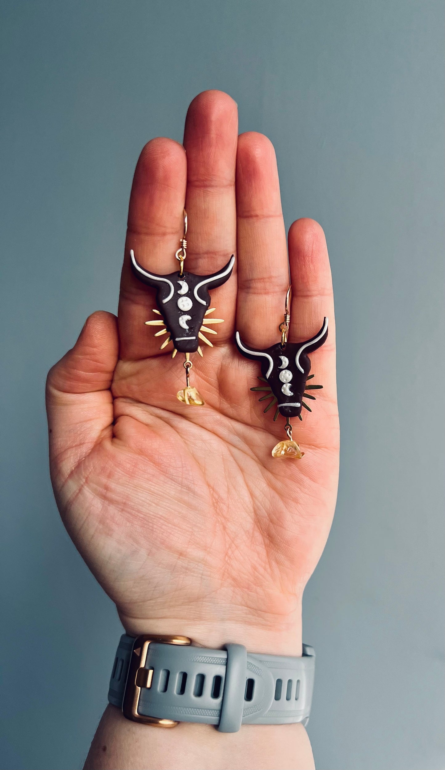 Symbolic polymer clay Taurus earrings embodying the traits of stability and determination. Handcrafted with precision, these earrings showcase the enduring nature of the Taurus sign, reflecting reliability and strength. Elevate your style with this representation of Taurus symbolism. Shop now and embrace the steadfast energy of the bull!