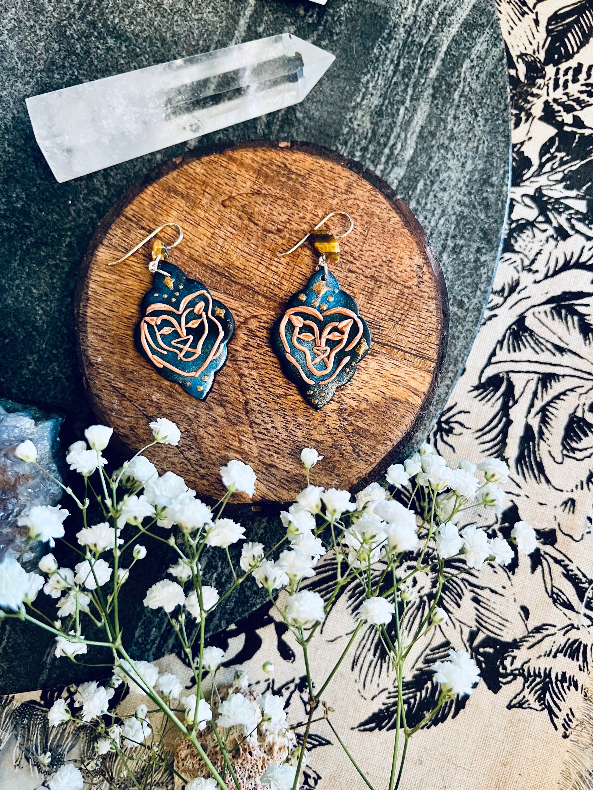 Mesmerizing night sky Leo earrings, capturing the celestial beauty of the zodiac. Handcrafted with care, these earrings feature intricate designs reminiscent of the cosmos, perfect for Leo's bold and confident personality. Illuminate your style with these stellar accessories. Shop now and shine like the stars!