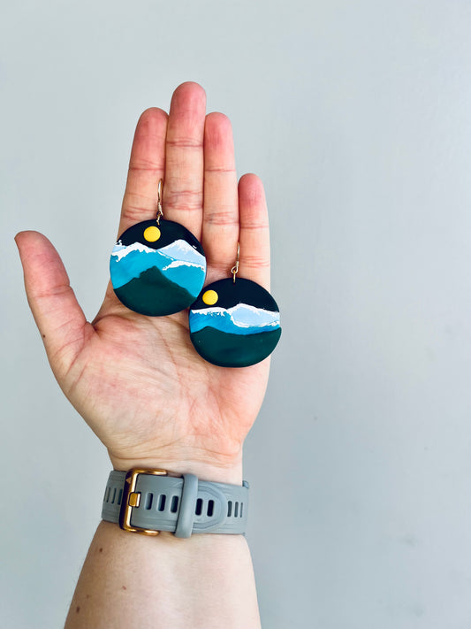 Embrace the spirit of the Colorado Rockies with our blue mountain earrings, inspired by the stunning landscapes of the Rockies. These earrings evoke a sense of adventure and natural beauty, perfect for nature enthusiasts