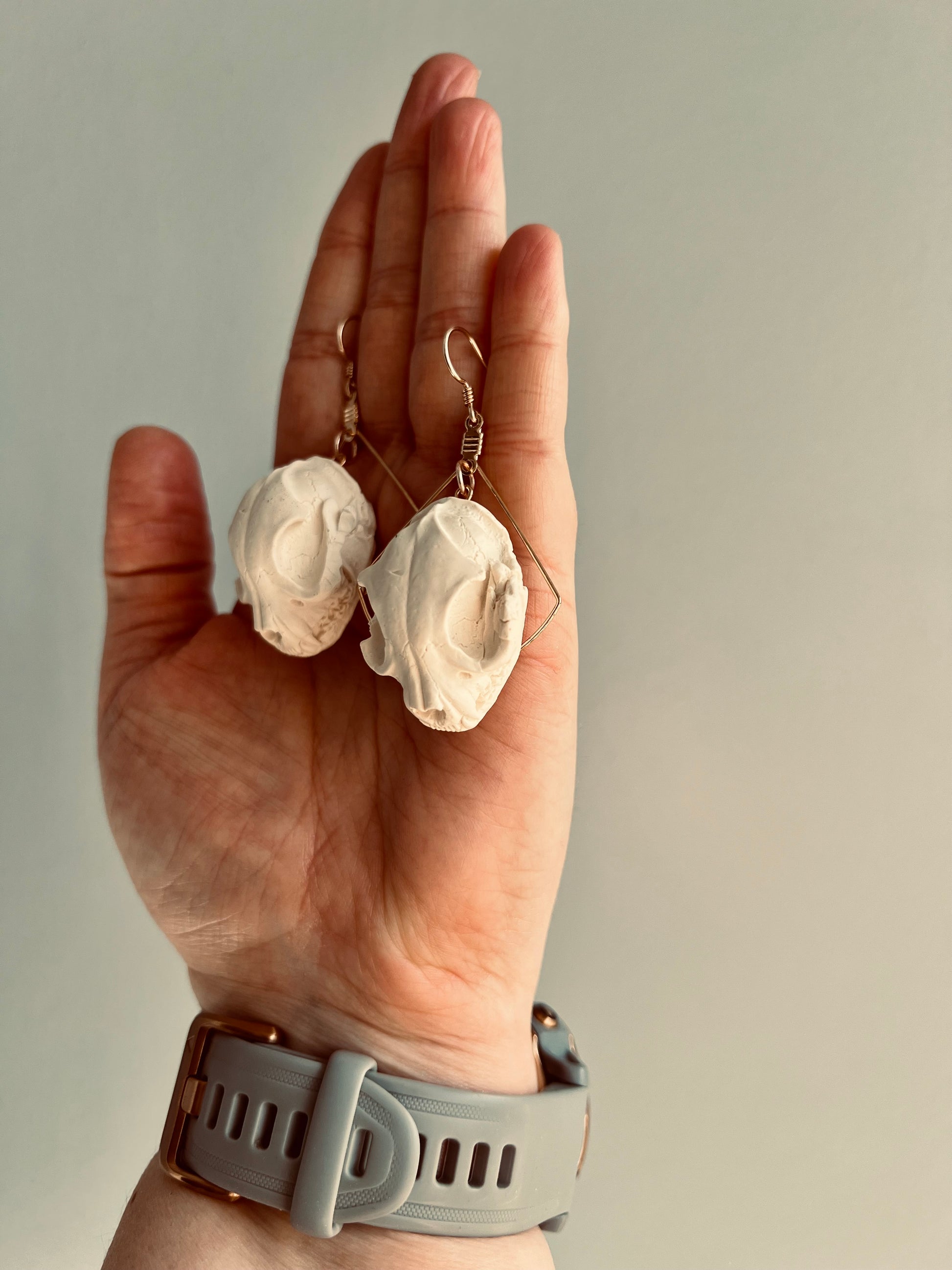 Unleash your inner witch with our polymer clay earrings featuring a cat skull design, a symbol of mysticism and intuition. Embrace the enchanting world of witchcraft with these statement accessories that add a touch of magic to your style. Perfect for expressing your love for the occult and the spiritual bond between humans and cats.