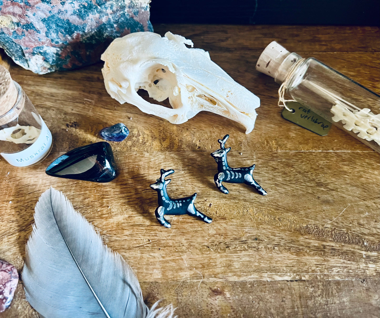 Capture the dark allure of our reindeer skeleton earrings, where black meets silver in a captivating display of gothic sophistication.