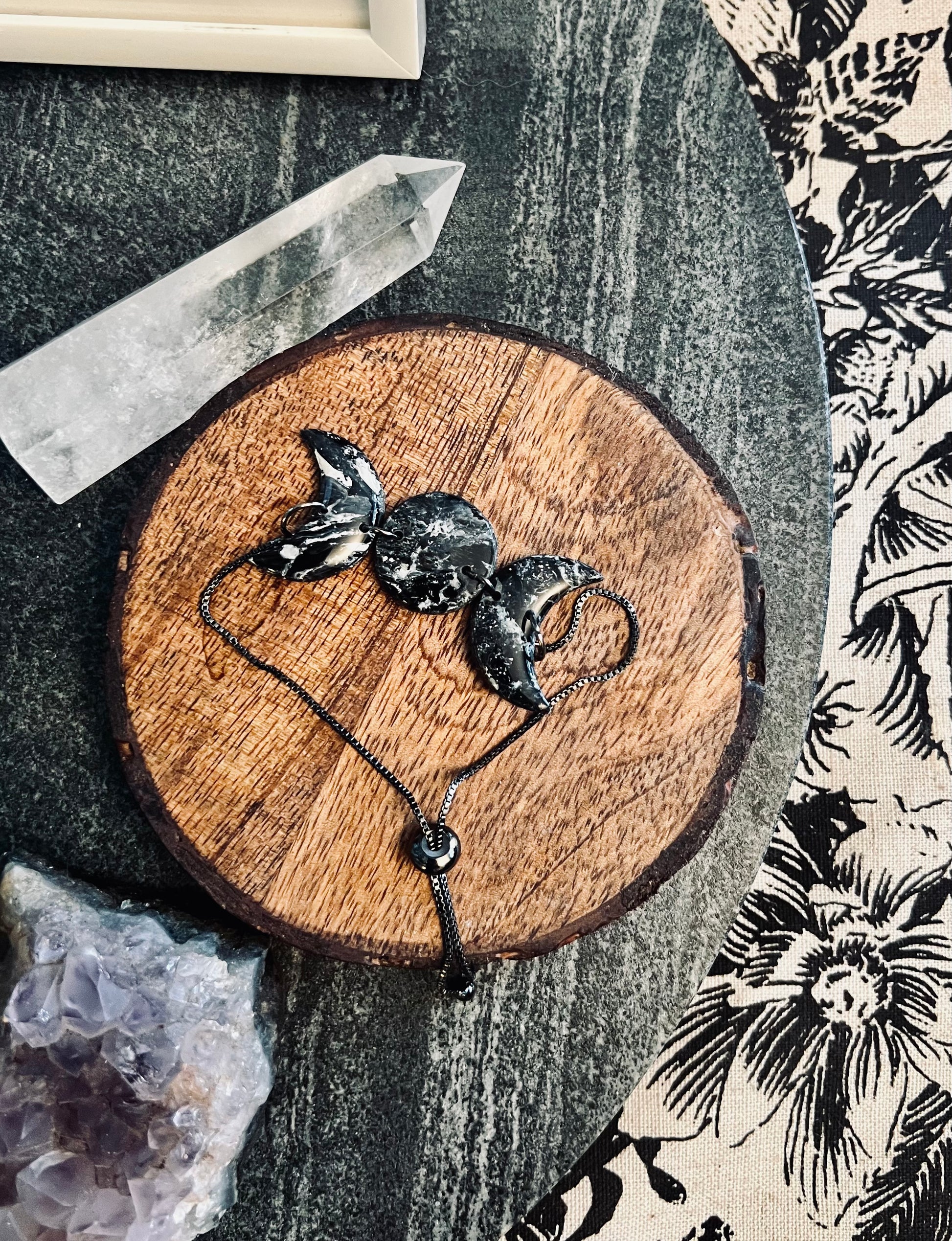 Capture the allure of the night sky with our handmade polymer clay black moon bracelets, perfect for celestial enthusiasts