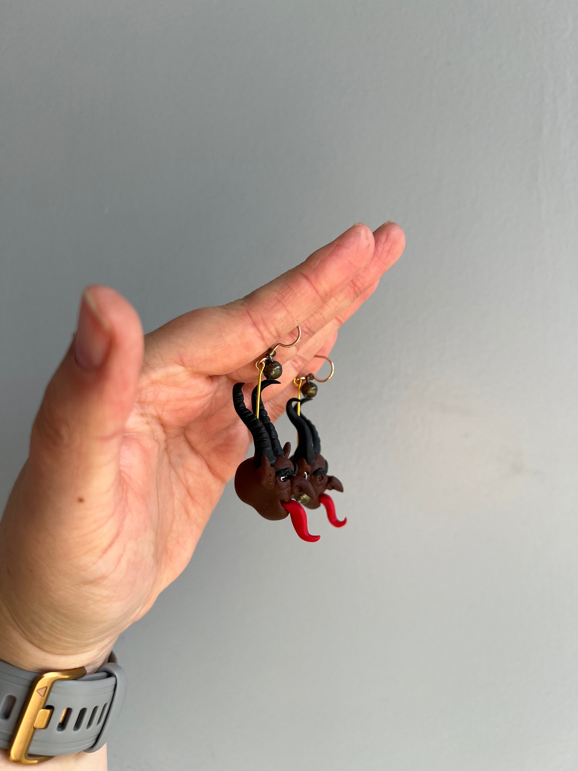 Dare to dance with darkness with our Krampus earrings, boasting hand-sculpted details and eerie bells that add an extra layer of spookiness to your ensemble.