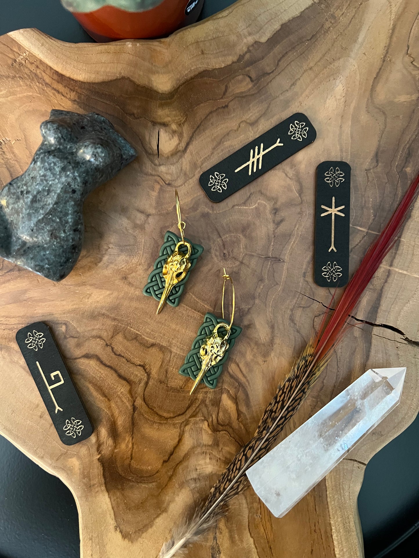 Dive into whimsical elegance with our hummingbird skull earrings, featuring a green Celtic sailor knot. Symbolizing joy and resilience, the hummingbird motif adds a charming touch to these unique accessories. Embrace nature's beauty and Celtic heritage with these captivating earrings.