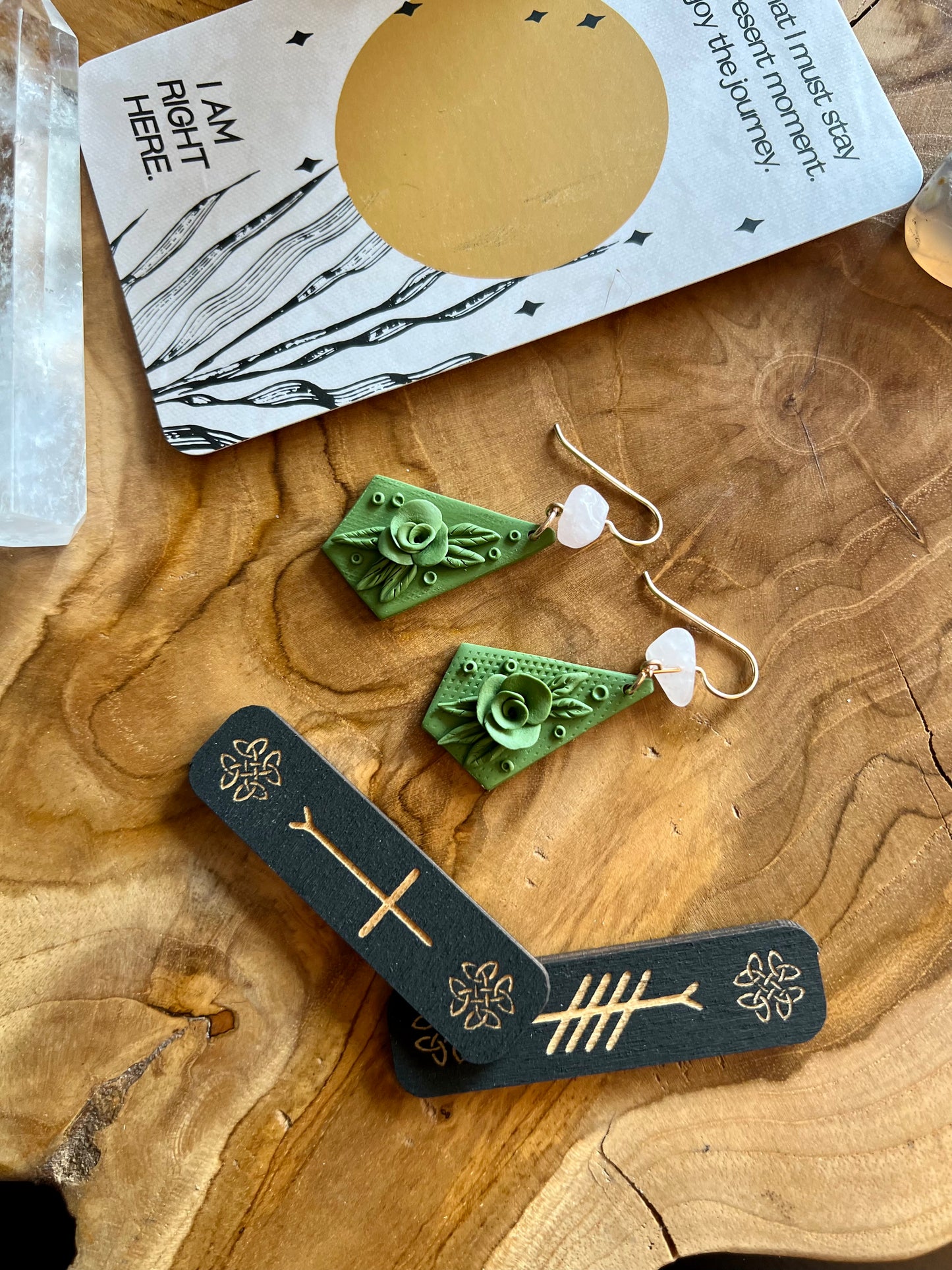 Illuminate your aura with our olive-colored earrings, featuring delicate botanical details and the loving embrace of rose quartz crystals, fostering compassion, forgiveness, and happiness.