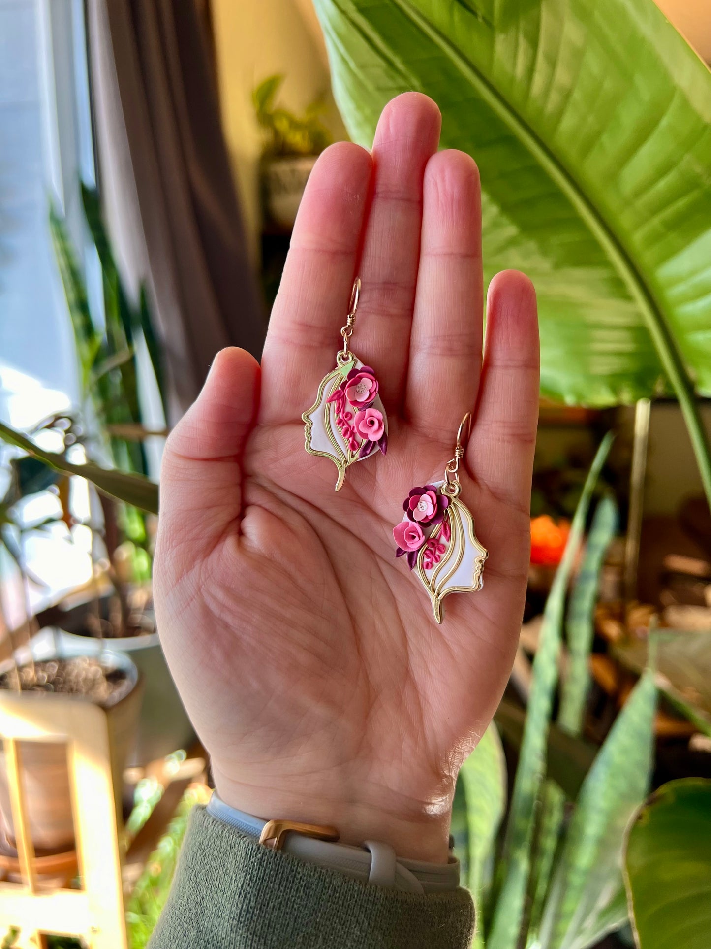 Channel the power of Freyja with these polymer clay earrings. Handcrafted with care, each pink flower represents the Norse goddess's attributes of love, fertility, and war. Enjoy hypoallergenic comfort with 14k gold-filled findings.