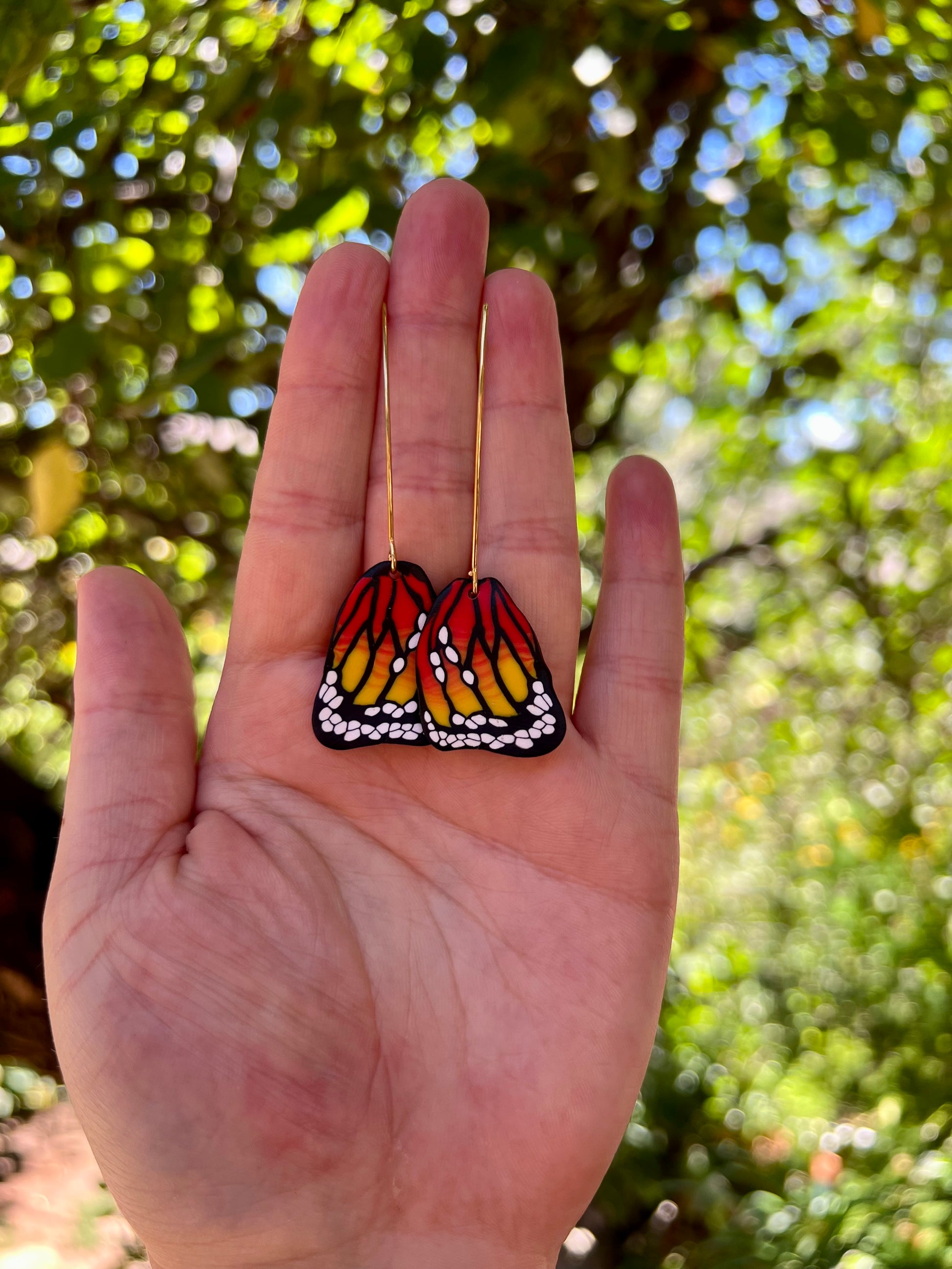 Celebrate the symbolism of the monarch butterfly with our handmade polymer clay earrings. Representing strength and rebirth, each pair is crafted with meticulous attention to detail using the Cane technique.