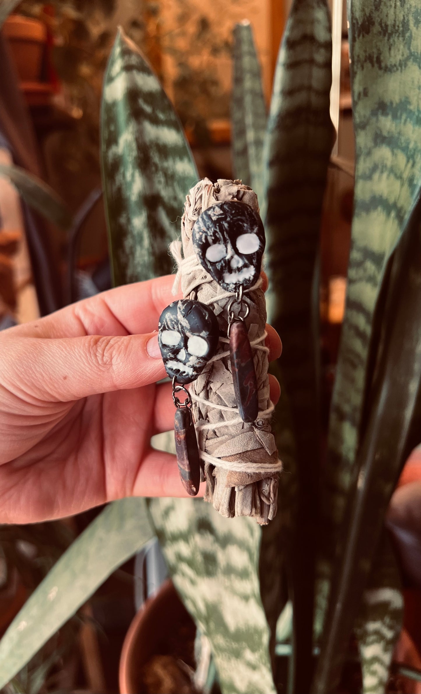 Marbled skull ear candy, these handcrafted polymer clay skull earrings embody the mystical essence of ancient secrets and wisdom. They also feature a red jasper stone, to bring the wearer strength and endurance. 