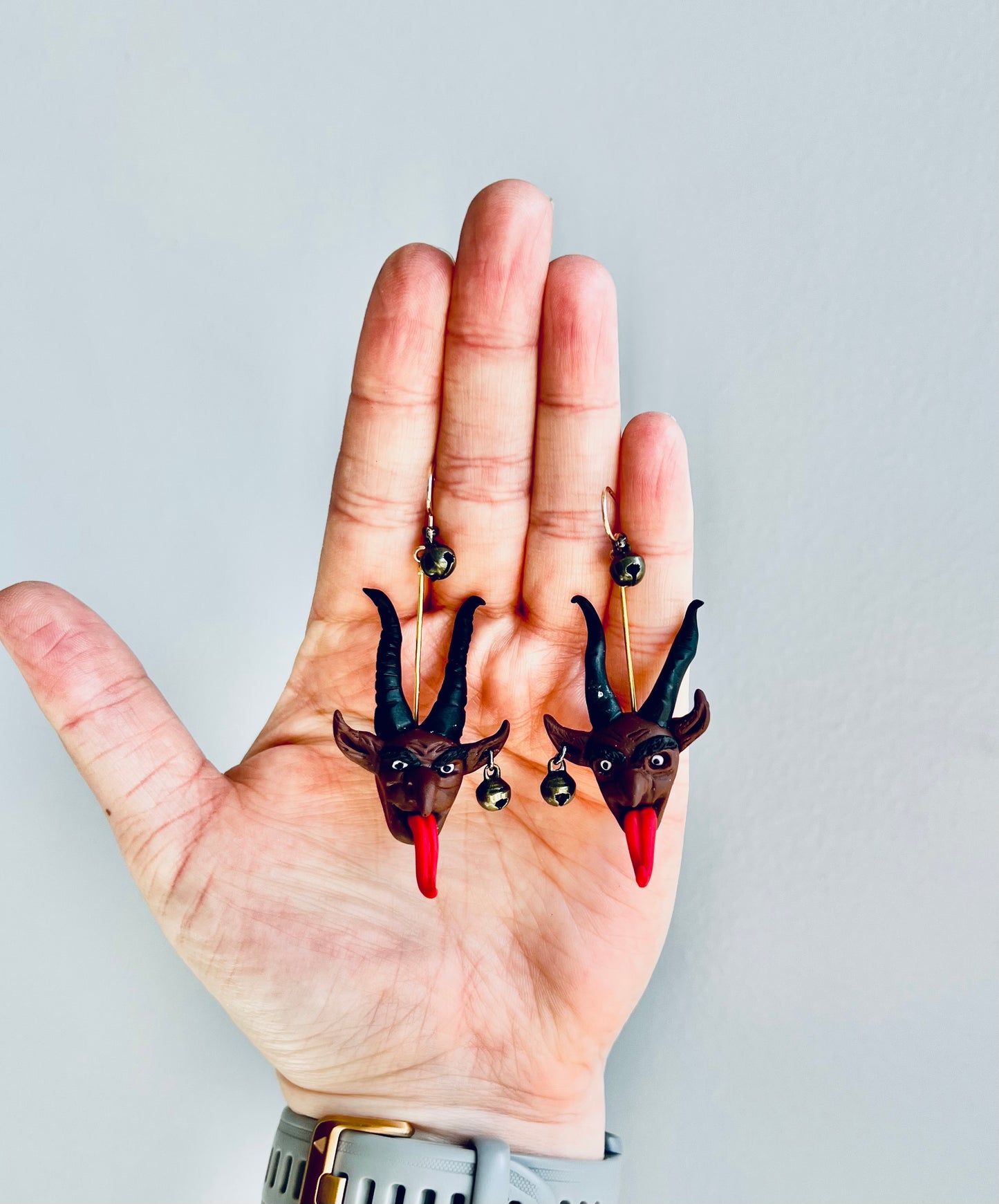 Embrace the spooky season with our hand-sculpted Krampus earrings, complete with eerie bells that jingle with every movement.