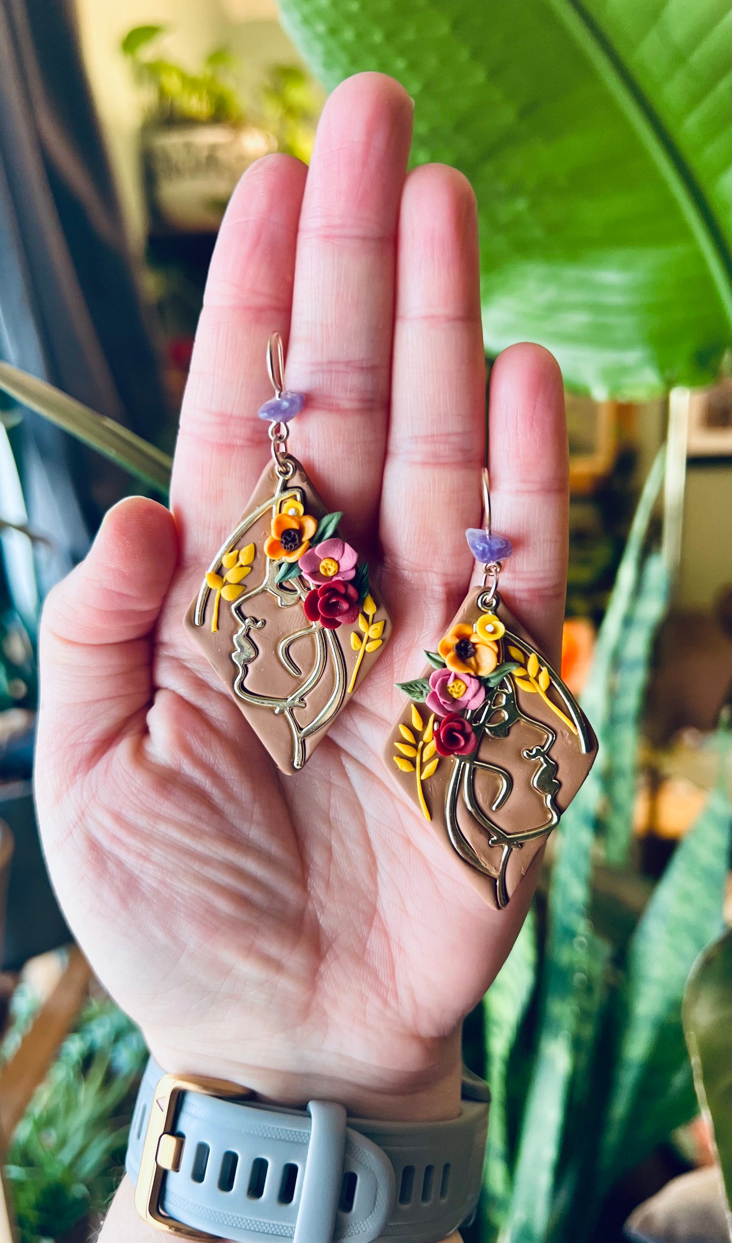 Elegant polymer clay Virgo earrings adorned with a stunning amethyst healing crystal accent. Handcrafted with care, these earrings embody Virgo's meticulous nature while harnessing the calming and protective properties of amethyst. Elevate your style and energy with these artisanal accessories. Available now!