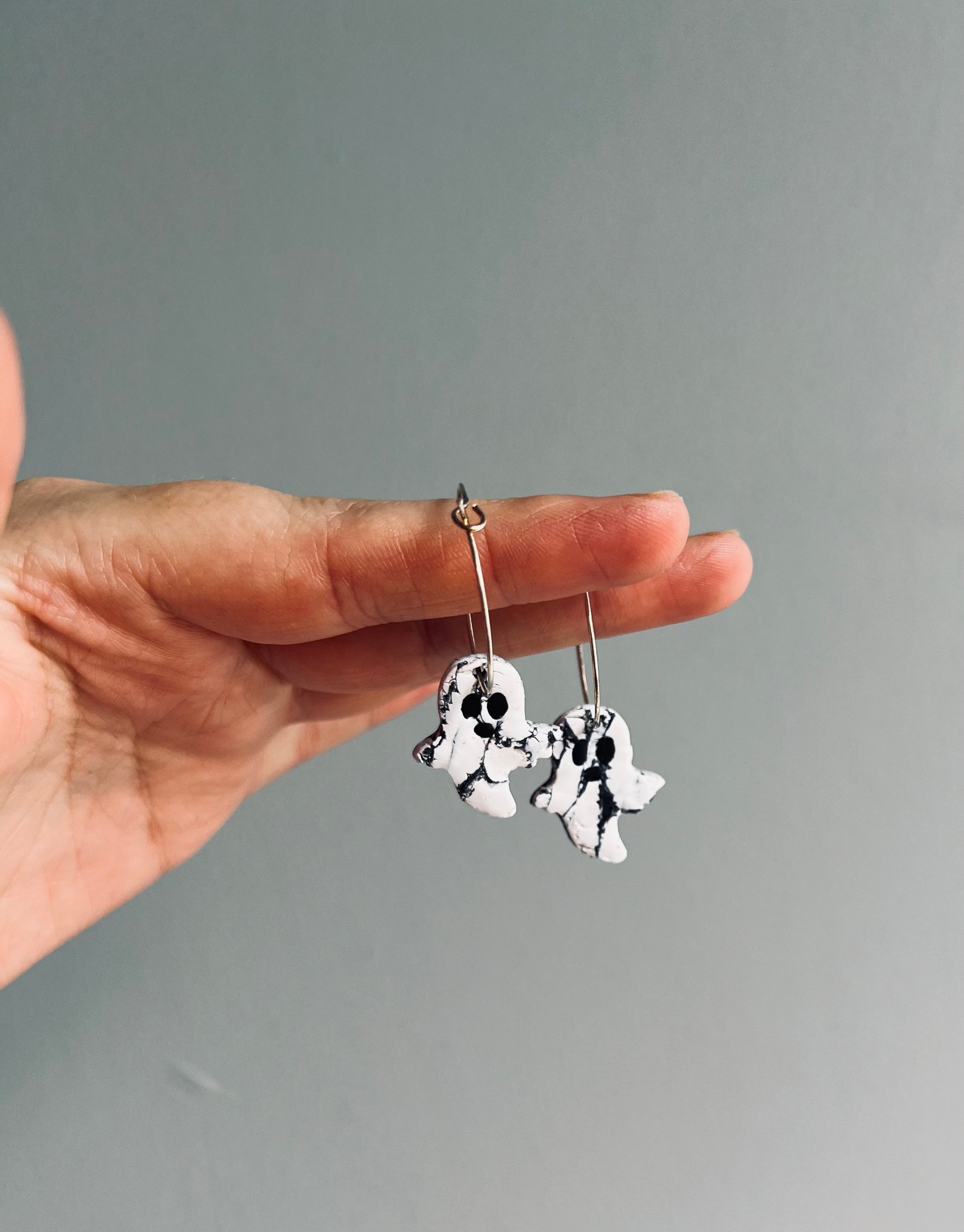 Add a whimsical flair to your style with our polymer clay ghost earrings, a fun accessory for embracing the spirit of Halloween year round!