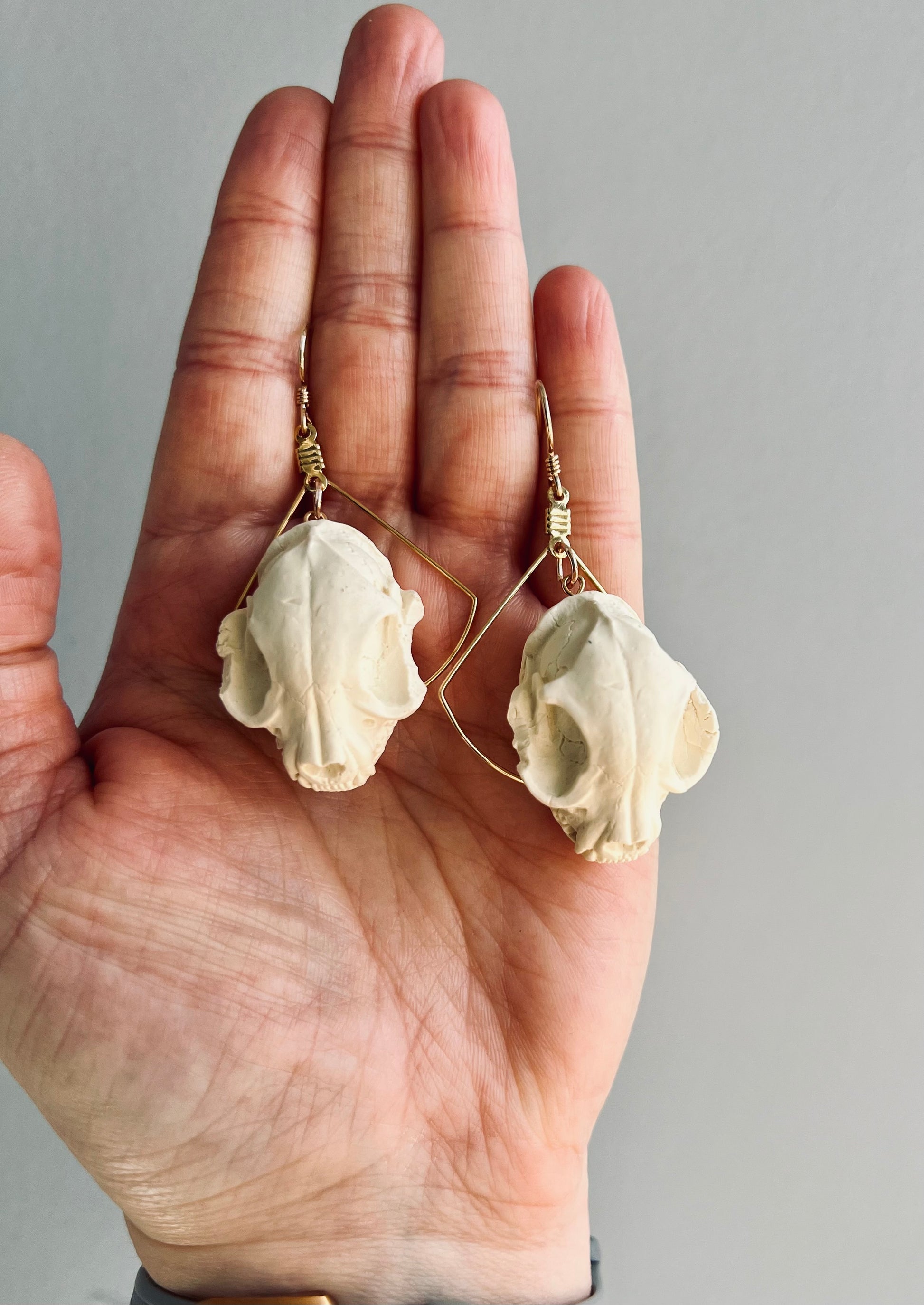 Embrace the enchanting allure of witchcraft with our polymer clay earrings showcasing a cat skull design. Symbolizing the mystical connection between witches and their feline companions, these earrings add a touch of magic to any outfit. Make a statement with these bewitching accessories that capture the essence of witchcraft and mystery.