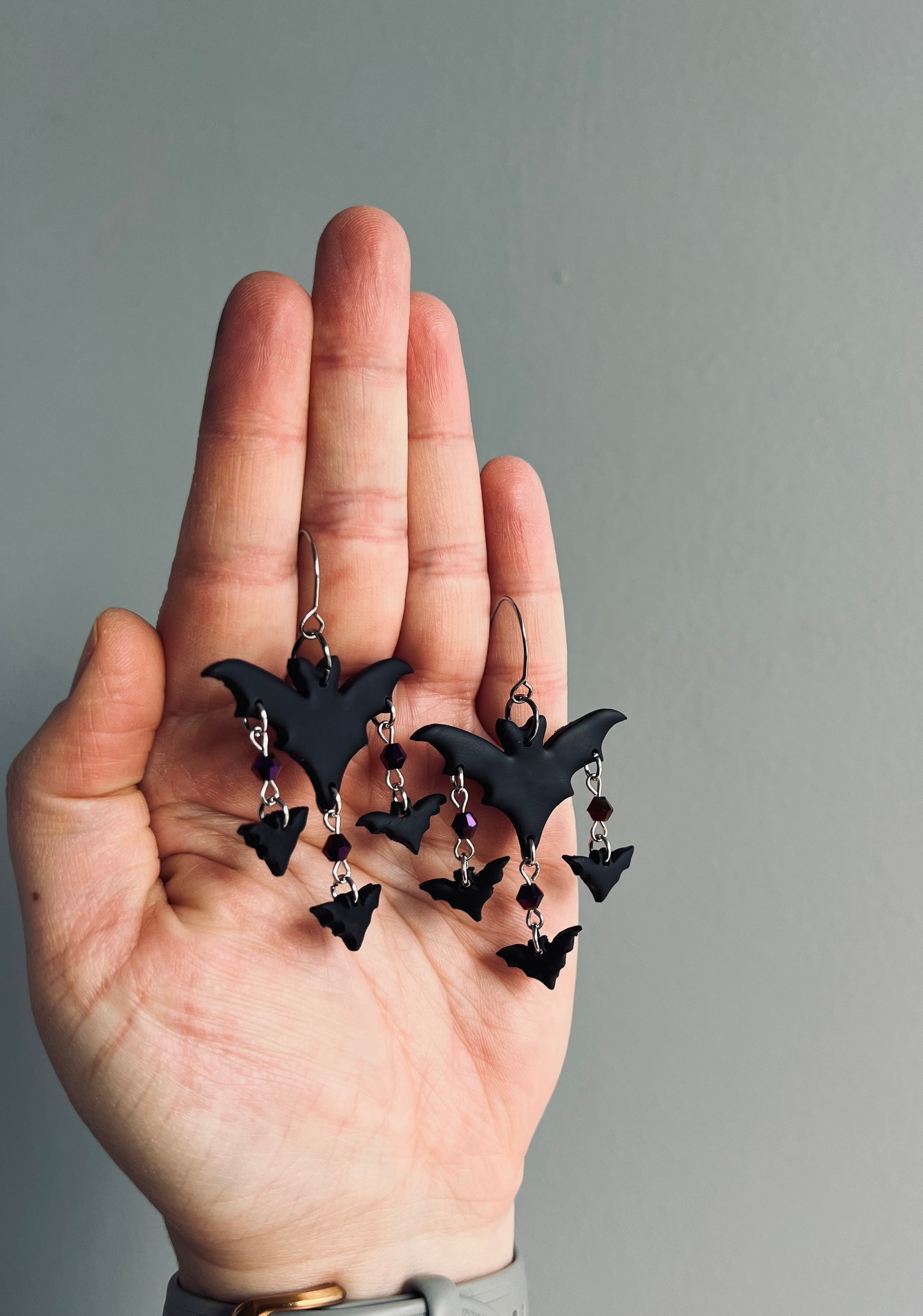 Fly into the night with our black bat earrings, soaring against the dark sky. These striking accessories embody the mystique of the nocturnal world, perfect for adding a touch of gothic charm to any ensemble.