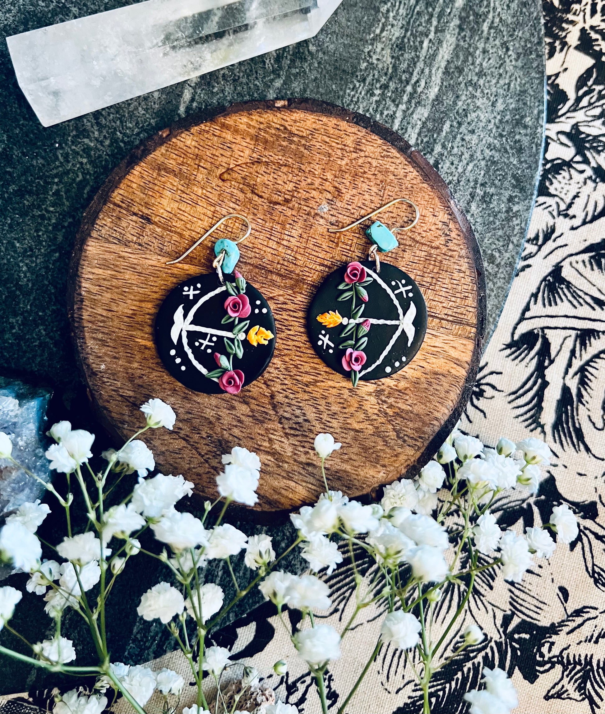 Intricate polymer clay Sagittarius earrings with hand-sculpted roses and a flaming arrow design. Meticulously crafted, these earrings symbolize the adventurous and passionate nature of Sagittarius. Shop now for a distinctive expression of Sagittarian energy!
