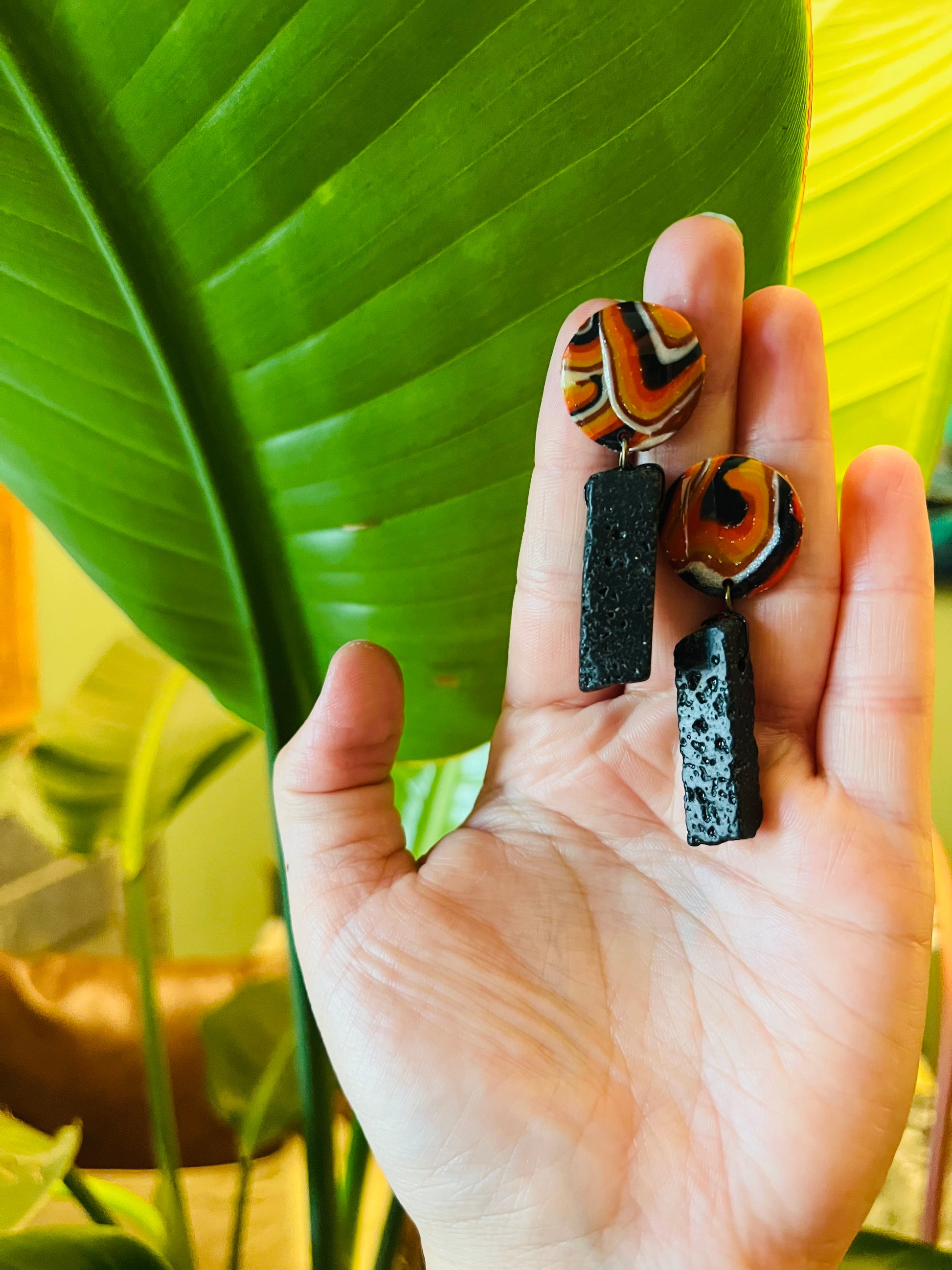 Empower yourself with natural lava stone earrings. Lava stone symbolizes rebirth, strength, and grounding, offering calming effects and a connection to Mother Earth.