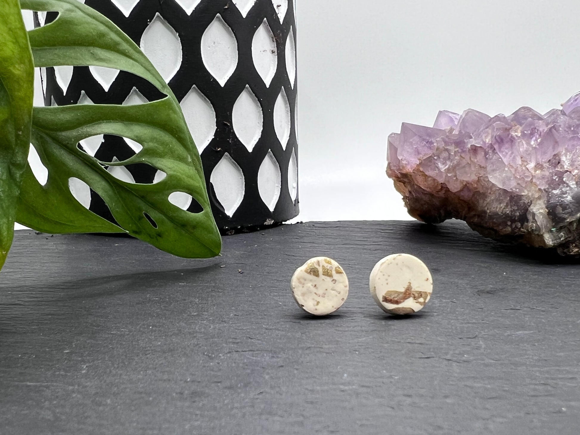 White and gold polymer clay stud earrings.