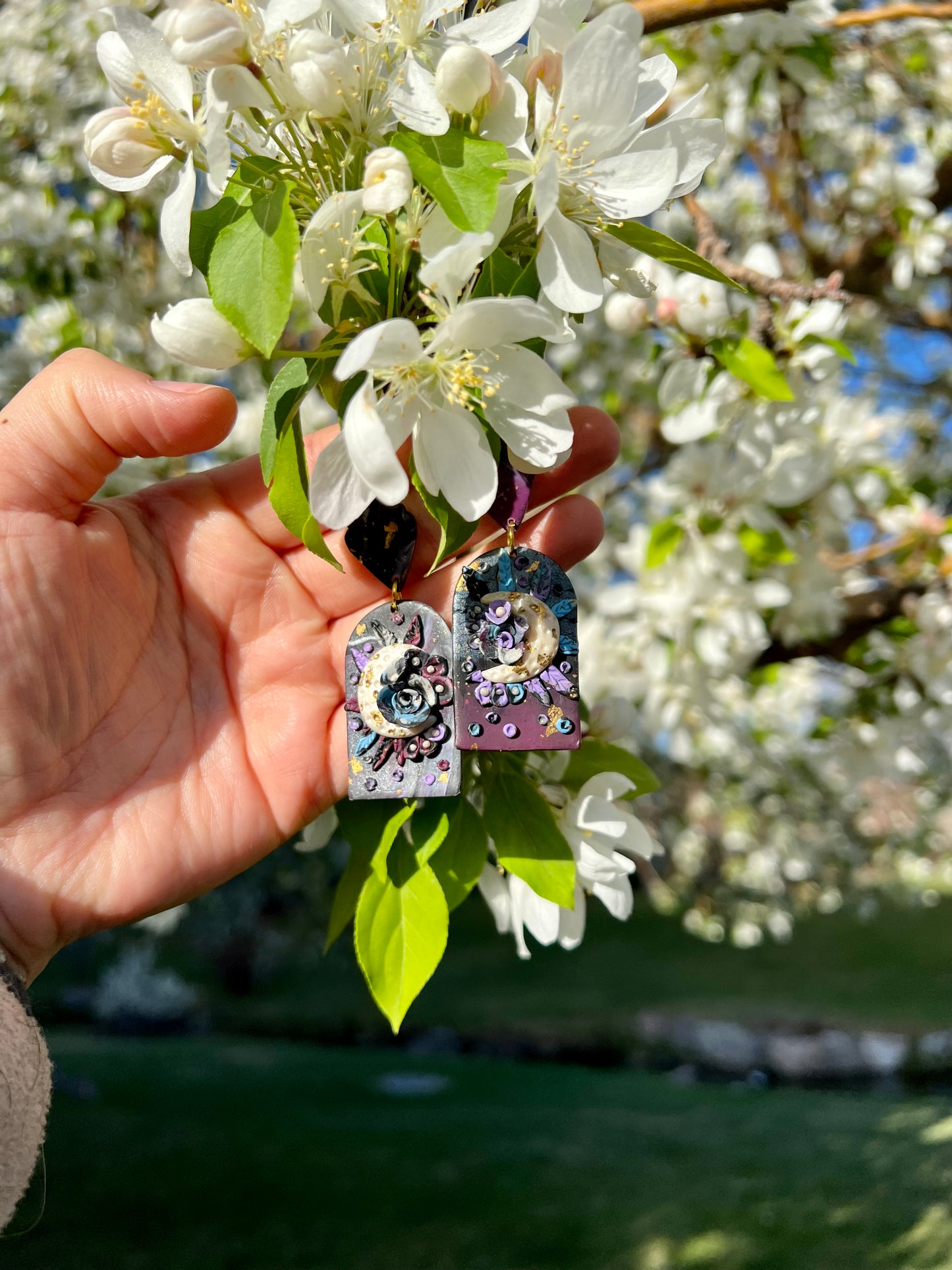 Adorn yourself with the essence of spring with these floral earrings. Crafted with care from kato polymer clay, they symbolize the blooming of flowers during May's Flower Moon. Enjoy both style and comfort with nickel-free, hypoallergenic posts