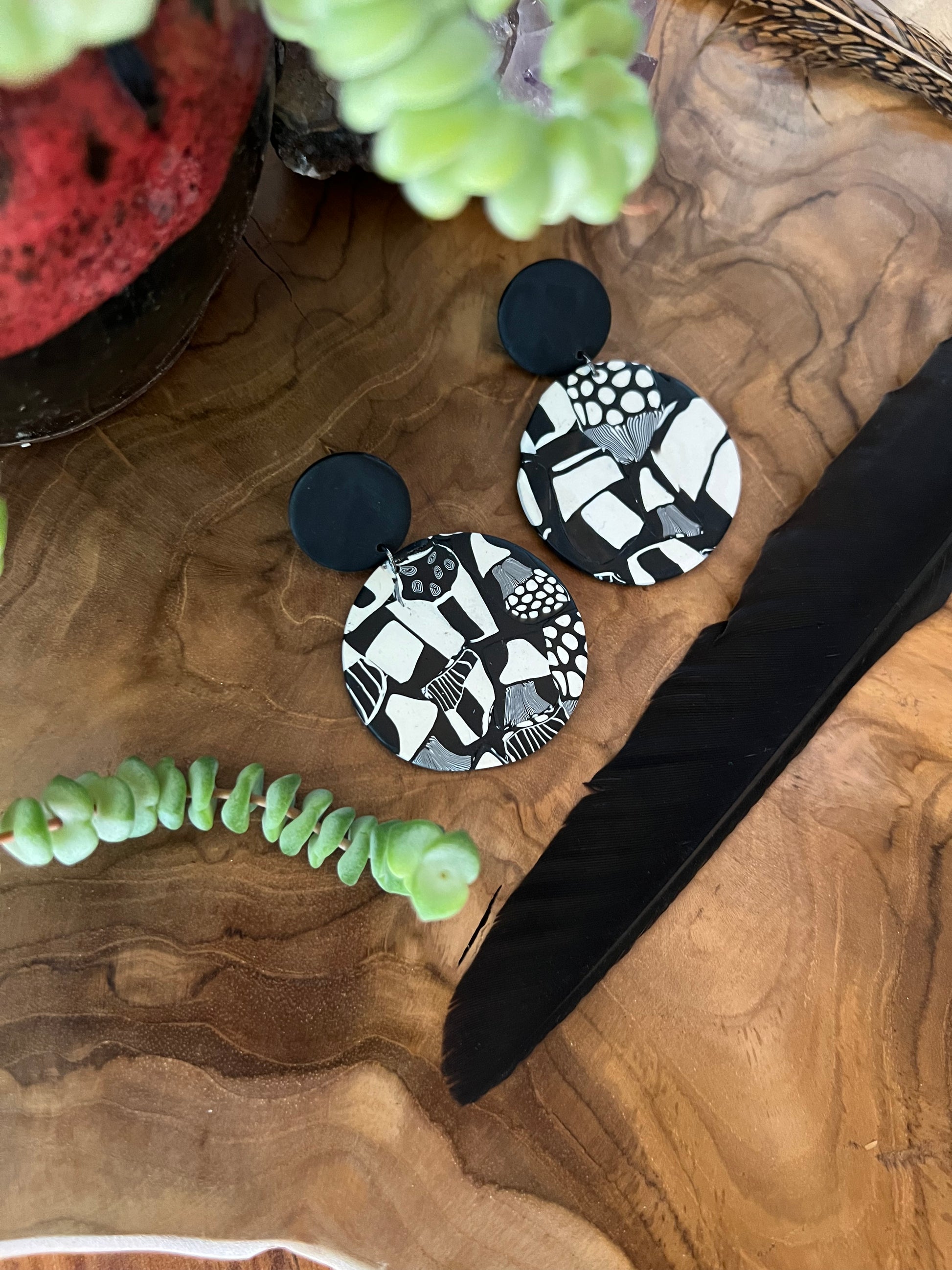 Complete your look with our adorable round mushroom earrings, crafted from polymer clay. These whimsical accessories add a touch of woodland charm to any outfit. Embrace nature-inspired style with these delightful statement earrings.